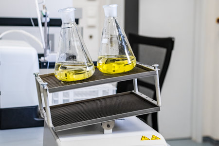 Samples shaking on the laboratory shaker, preparing them for further analysis in the laboratory.の写真素材