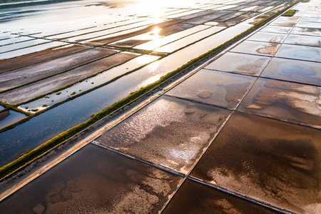 For sea salt production, seawater fills the salt pans on Pag Island. Croatia.の写真素材