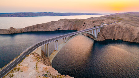 Pag Bridge offers scenic views of Adriatic Sea bays and hilly landscape. Infrastructure provides access to island creating easy navigationの写真素材
