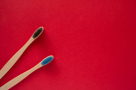 Toothbrushes on isolated red backgroundの写真素材