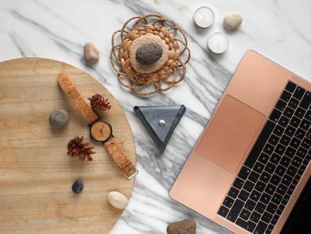 Work from home, desk creative office with laptop, marble, wallet and watchの写真素材