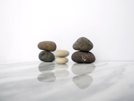 Flat lay composition with spa stones and space for text on white backgroundの写真素材