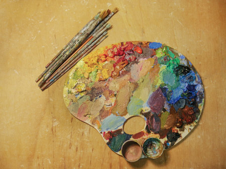 close-up of art palette on background. Bright spots of oil paints. There is room for text.の写真素材