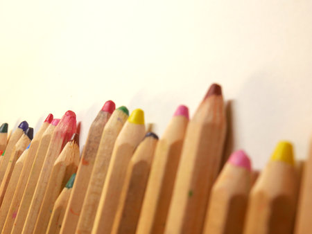 Seamless colored pencils row with wave on lower sideの写真素材