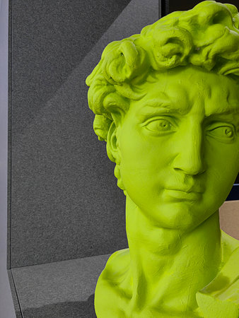 Statue replica of the famous sculpture by Michelangelo David in green colors. Man portrait with...