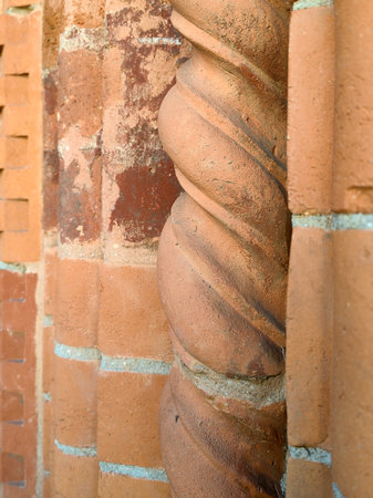 Ancient red brick columns in a wall of a palace in Milan.の写真素材