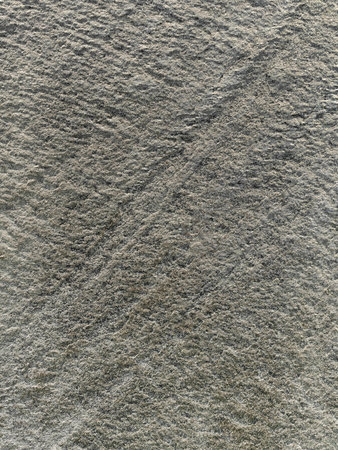 Background of a stone pattern close-up with rich colors and texture for home interior decoration.の写真素材