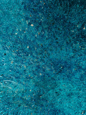 Ethereal abstract design featuring a blend of iridescent colors refracting through a glass texture...