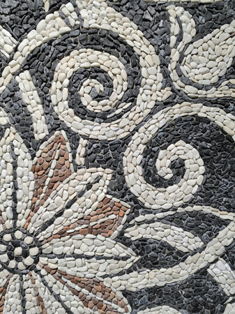 Square surface is a traditional-style pavement. It consists of small flat pieces of stones arranged in a pattern or image, like a mosaic.の写真素材
