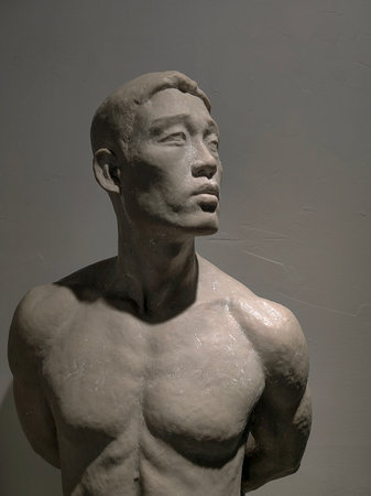 Art school education and master class of fine art. Art and sculpture. Male artist posing gypsum sculpture at workshop on white wall background.の写真素材