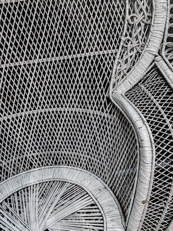 Close up detail of a white traditional tropical macrame chair bamboo for home decoration.の写真素材