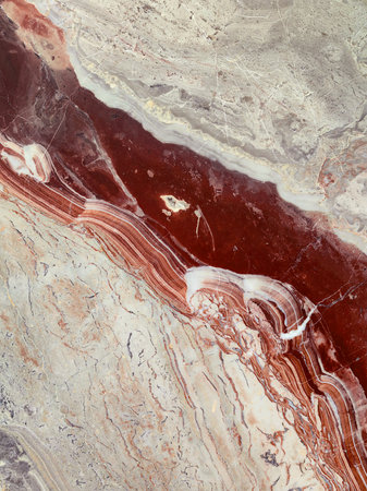 Marble or stone texture in light colors with intense red veins