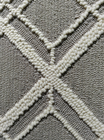 Various size of geometry embroidery pattern on soft beige gray linen fabric background.の写真素材