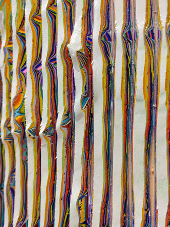 Abstract art painted background texture made of different layers of colored papers.