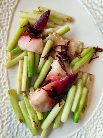 Closeup detail of fresh and healthy seafood salad with vegetables.