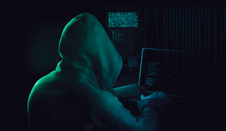 dark web hooded hackerの写真素材
