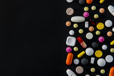 Various Tablets And Pills On A Black Backgroundの写真素材