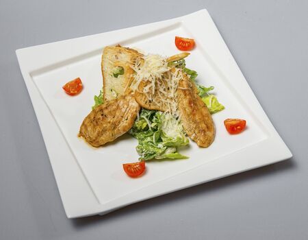 Unusual Caesar Salad On A White Square Plateの写真素材