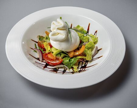 Burrata Cheese On The Vegetable Bedの写真素材