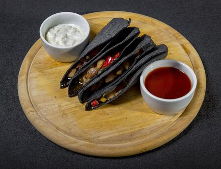 Black Tortilla Triangles With Vegetable Stuffingの写真素材