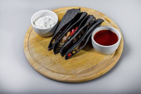 Black Tortilla Triangles With Vegetable Stuffingの写真素材