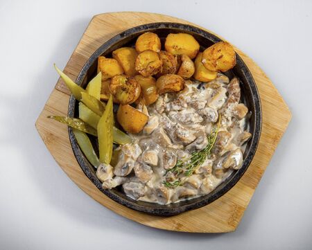 Beef Stef In Creamy Sauce With Baked Potatoes And Pickled Cucumbersの写真素材