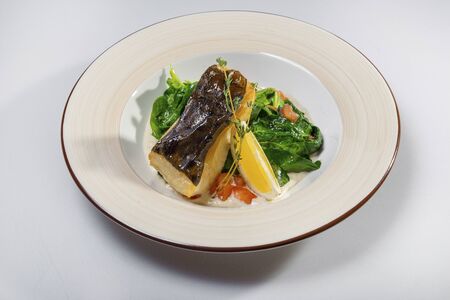Fried Halibut With Stewed Spinachの写真素材