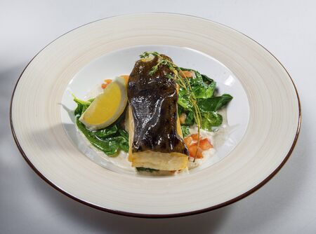 Fried Halibut With Stewed Spinachの写真素材