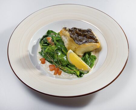 Fried Halibut With Stewed Spinachの写真素材
