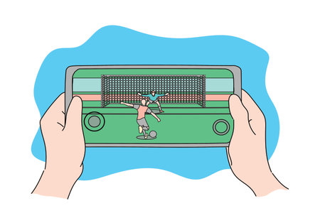 Hand holding a gadget smartphone playing football sport mobile game. Flat designのイラスト素材