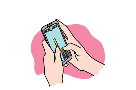 Hand holding a mobile phone playing puzzle game. Flat designのイラスト素材