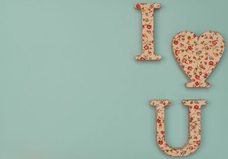 Valentine's Day blue background with heart and two letters. Valentine greeting card. Flat lay style.