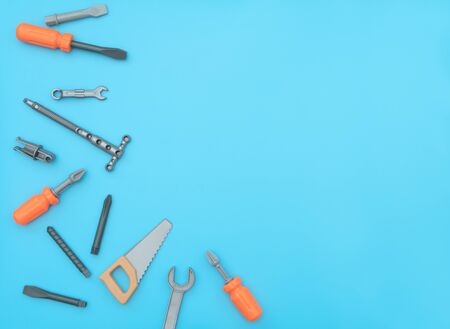 Kids set of working tools on blue background. Father day, construction industry, building and repair concept. Flat lay style with copy space for text.の写真素材
