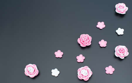 Pink and white flowers made of foamiran on black background. Mother day, Valentine day, Wedding,...