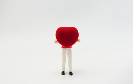 Man with big heart shaped box in his hands on white background. Valentine Day, holiday concept. Greeting or invitation card. Copy space for text.の写真素材