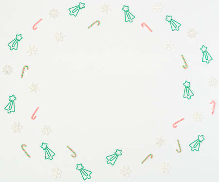 Christmas tree formed clips, Xmas canes, wooden snowflakes on white background. Back to school,...