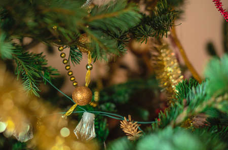 Abstract defocused Christmas or New Year background with blurred decorated Xmas tree close up. Holiday concept. Greeting or invitation cardの写真素材