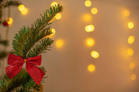 Christmas and New Year background. Close-up Xmas tree with decorations on abstract background with copy space. Greeting or invitation card. Holiday conceptの写真素材