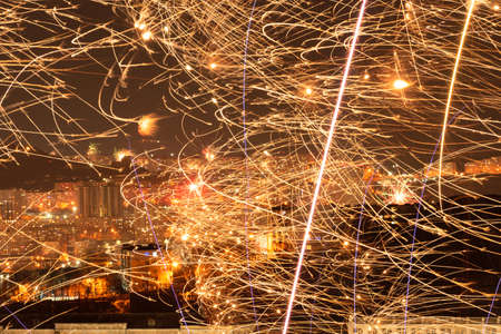 Fireworks in the city at night during New Year celebration. Soft focus background