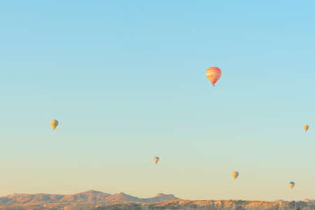 Hot air balloons in the sky during sunrise. Travel, dreams come true conceptの写真素材
