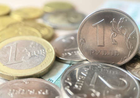 Russian rubles and euro coins with selective focus. Economic crisis, decline of the world economy concept. Currency exchange. Financial backgroundの写真素材