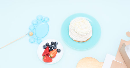 Ingredients for Pavlova cake: strawberries, blueberries and meringue with selective focus. Homemade pastry, delicious sweets concept. High quality photoの写真素材