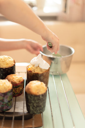 Woman making homemade Easter cake at home. Selective focus. Process of cooking at home. High quality photoの写真素材