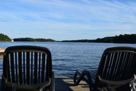 Lakeside dock chairsの写真素材