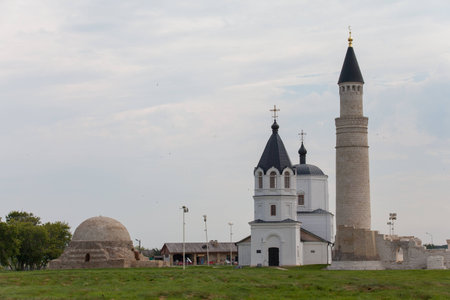 Beautiful mosque and church, against the blue skyの写真素材