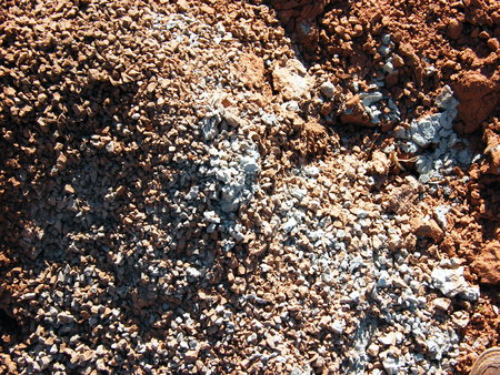 The picturesque combination of white and red clay, dry and crackedの写真素材