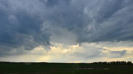 Clouds over the field after a storm.