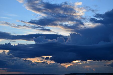Clouds over the field after a storm.の写真素材