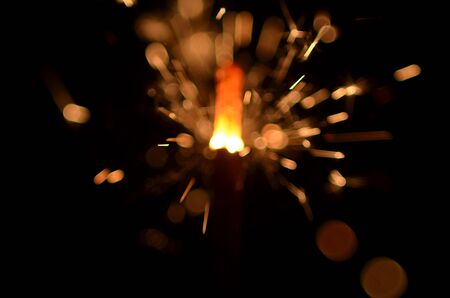 Burning sparkler isolated on black background in darknessの写真素材