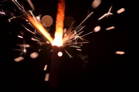 Burning sparkler isolated on black background in darknessの写真素材